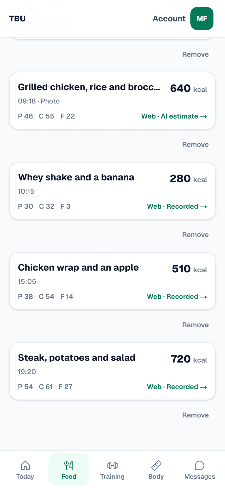 The Total Body Upgrade food day on a phone, showing a photographed meal with its calorie and macro estimate